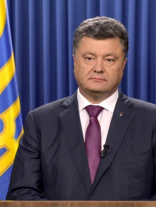 Ukrainian President Petro Poroshenko delivers a speech dedicated to his decree to dissolve...