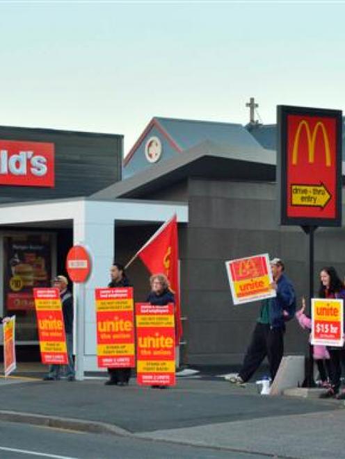 Unite Union members protest in what they called a 'McStrike' outside the North Dunedin branch of...