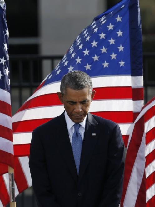 United States President Barack Obama pauses during a moment of silence at the Pentagon in...