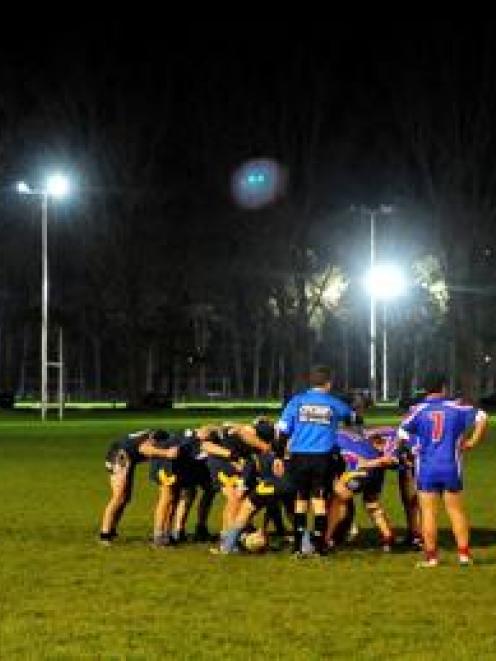 University and Harbour Seals players do battle under lights at Logan Park during a club rugby...