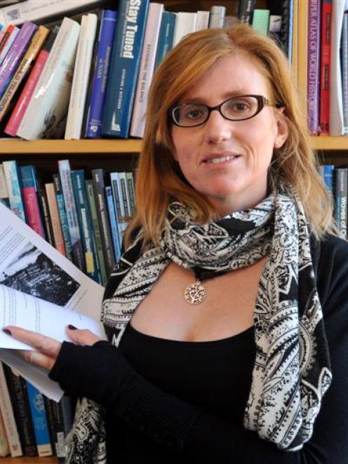 University of Otago academic Dr Erika Pearson is pictured with a downloaded version of a new...