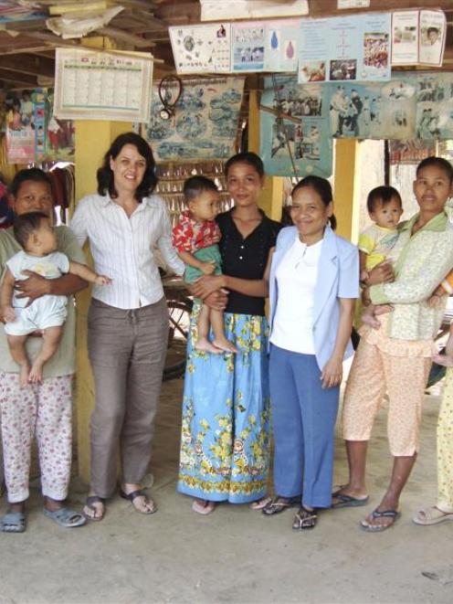 University of Otago doctoral researcher Dr Susan Jack is pictured with Cambodian mothers involved...