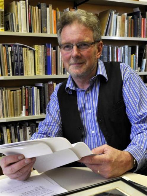 University of Otago English scholar Dr Paul Tankard (right) considers on a transcript of a lost C...