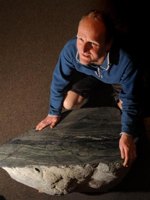 University of Otago geologist Prof David Prior examines an ancient lump of Westland schist, ...