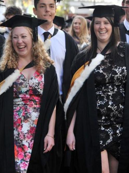 University of Otago graduands Mellora Ford (left) and Rochelle Hawkins enjoy the moment, as the...