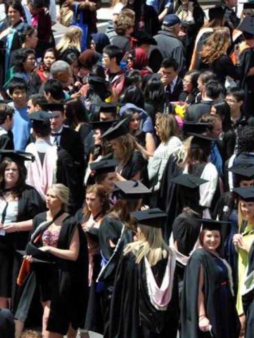 University of Otago graduands move towards a capping ceremony at the Dunedin Town Hall on...