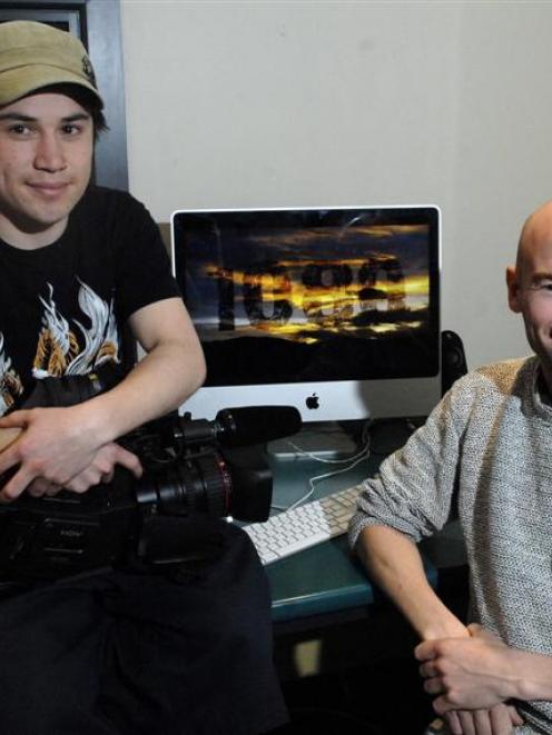 University of Otago masters students Steve Ting (left) and Pete Holmes take a rest after putting...