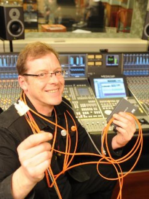 University of Otago music technician Stephen Stedman with the fibre-optic cable and converters...