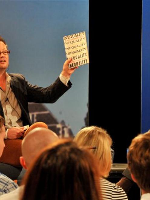 University of Otago politics lecturer Dr Bryce Edwards holds a copy of Inequality: A New Zealand...