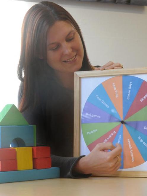 University of Otago psychology researcher Dr Dione Healey, pictured with building blocks, and a...