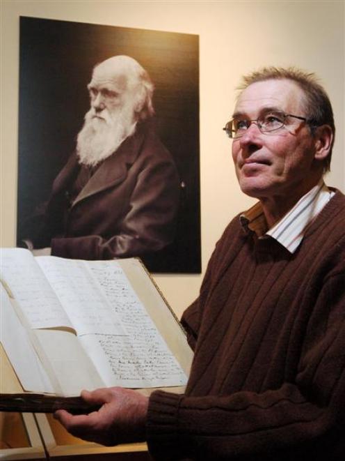 University of Otago special collections librarian Dr Donald Kerr holds a letter written by...
