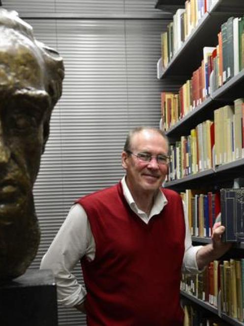 University of Otago Special Collections librarian Donald Kerr browses through the Charles Brasch...