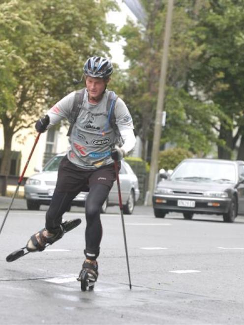 University of Otago student Scott Kvick (20) skikes through Dunedin yesterday, on his journey...
