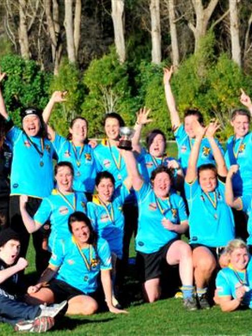 University players and management celebrate winning the Dunedin premier women's club rugby title...