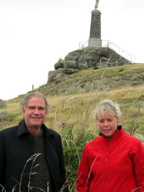 Unveiling near . . . Dunedin South Rotary Club members Norman Firth and Ginny Green descend from...