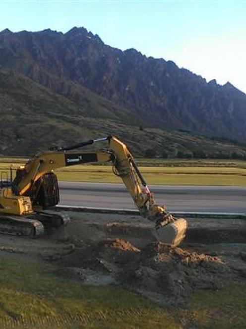 Upgrade work: Queenstown Airport contractors work in fading light late last year. PHOTO: SUPPLIED