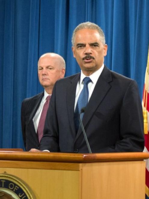 US Attorney General Eric Holder announces the indictments of five Chinese nationals on cyber...