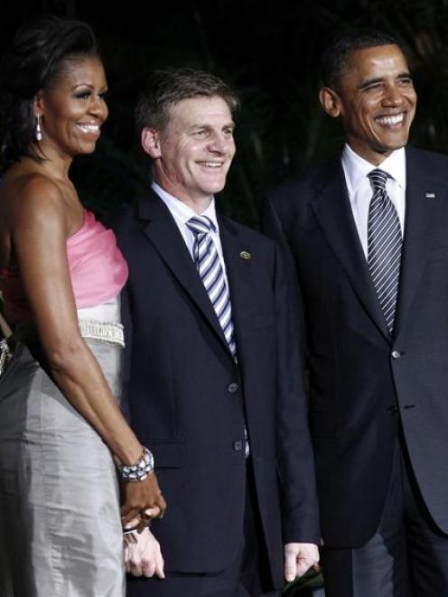 US President Barack Obama and First Lady Michelle Obama greet New Zealand Deputy Prime Minister...
