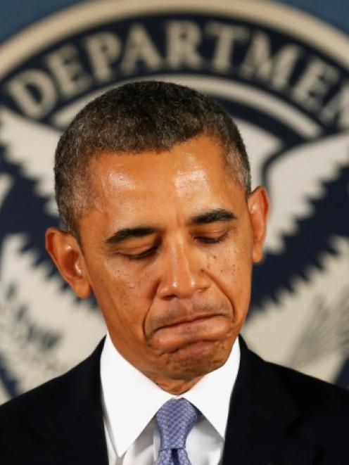 US President Barack Obama speaks about the government shutdown during a visit to the Federal...