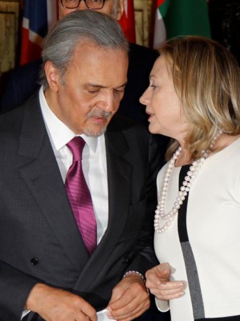 US Secretary of State Hillary Clinton (R) talks to Saudi Arabia's Foreign Minister Saud Al-Faysal...