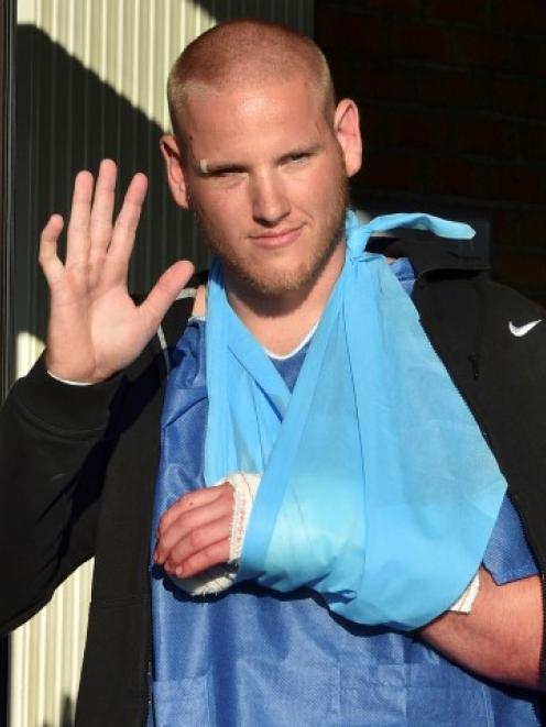 US serviceman Spencer Stone waves as he departs the Clinique Lille Sud in Lesquin, France....