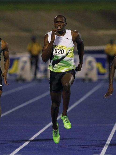 Usain Bolt of Jamaica sprints to win the men's 100 metres event at the Jamaica International...