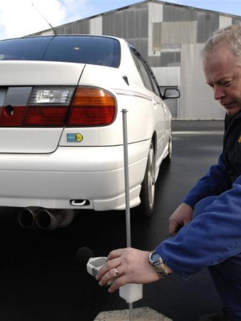 Vehicle Inspection New Zealand compliance certifier John Murdoch, of Dunedin, uses a digital...