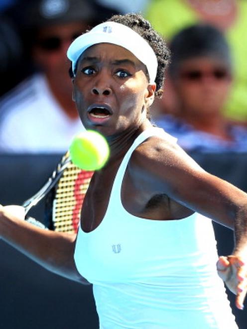 Venus Williams plays a forehand against Yvonne Meusburger.  (Photo by Anthony Au-Yeung/Getty Images)