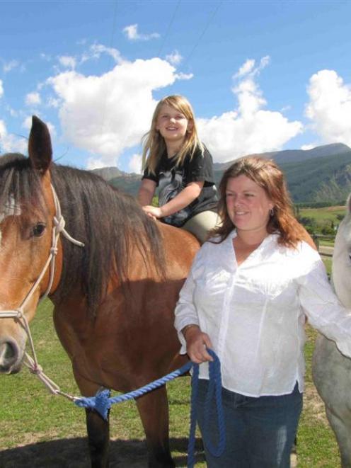 Vicki Bonham-Hoskin, with daughter Rebekah (7), has her hands full keeping the Spirit of Equus...