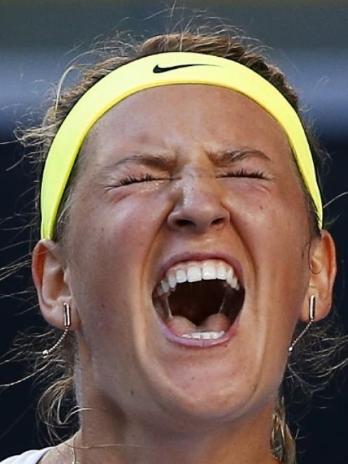 Victoria Azarenka of Belarus celebrates after defeating Barbora Zahlavova Strycova of the Czech...