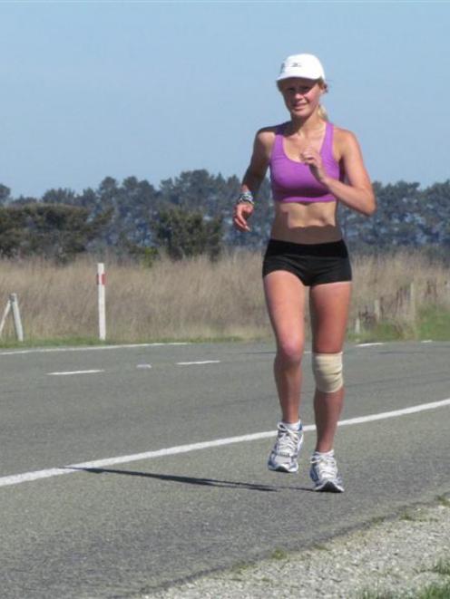 Victoria Taylor nears Glenavy on State Highway 1 yesterday during her big run  to raise awareness...