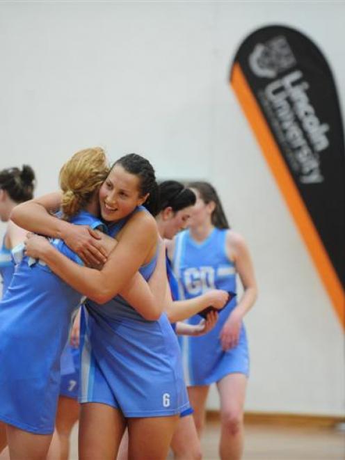 Villa Maria College goal shoot Grace Prendergast (left) and goal keep Joanna Trip share a hug to...