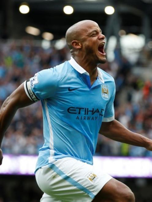 Vincent Kompany celebrates after scoring the second goal for Manchester City. Reuters / Andrew...