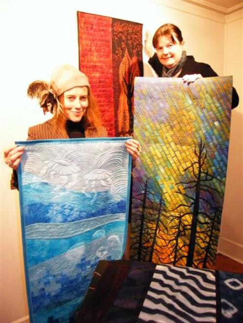 Visiting Oamaru artist Donna Demente (left), displays Hot Water-Dead Sea, by Jenny Bowker, while...