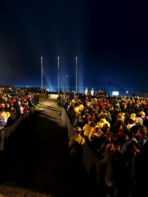 Visitors from Australia and New Zealand attend a dawn ceremony marking the 100th anniversary of...