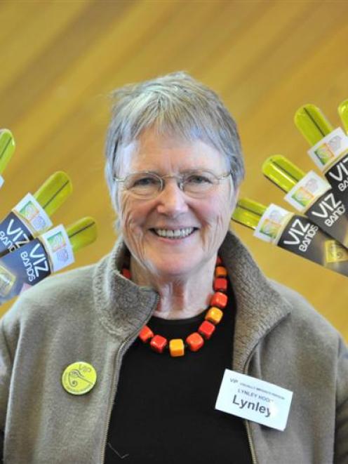 Visual Impairment Charitable Trust Aotearoa trustee Dr Lynley Hood displays Vizbands in the...