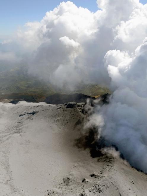 Volcanic smoke rise from Mt. Ontake, which straddles Nagano and Gifu prefectures, central Japan....