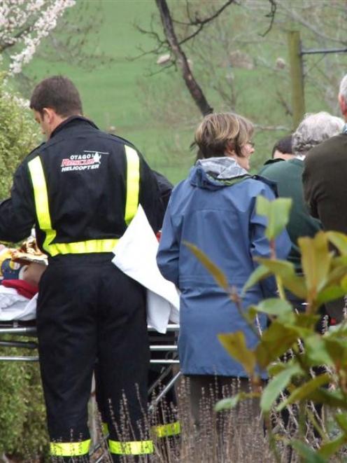 Volunteer fire crews, St John and police from Balclutha are pictured ferrying the man to the...