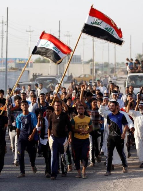 Volunteers who have joined the Iraqi Army to fight militants from the radical Islamic State of...
