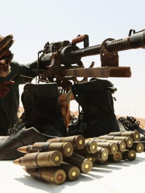 Volunteers with the anti-Gaddafi forces are seen in Al-Noflea, the closest area to Sirte, about...