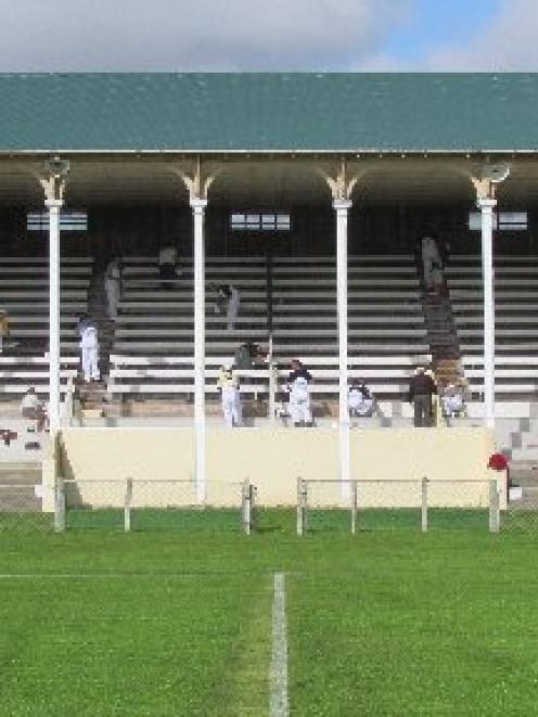 Volunteers work alongside representatives from Dulux to paint the North Otago Showgrounds...