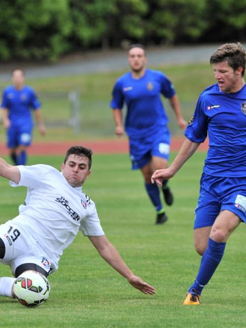 WaiBOP United midfielder Wade Molony (left) and Southern United midfielder Tim McLennan compete...