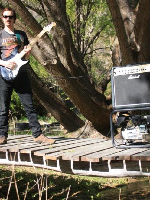 WaikeriFest organiser Andy Parsons, of Dunedin, tests out part of the stream-side location for...