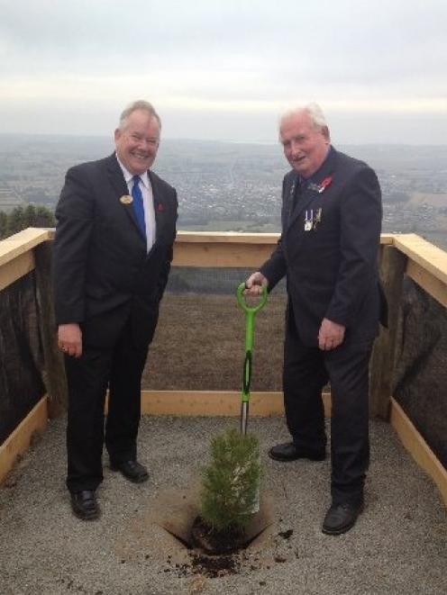 Waimate Mayor Craig Rowley (left) and Waimate RSA president Ron Bailey plant one of the Lone Pine...