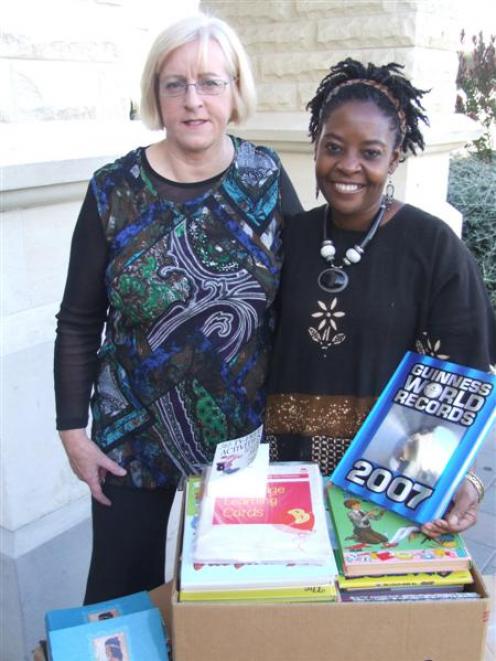 Waitaki Boys High School librarian Hilary Bishop (left) and Getrude Matshe display some of the...
