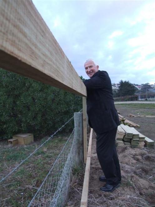 Waitaki Development Board chief executive Mark Jurisich looks at progress on a new fence being...