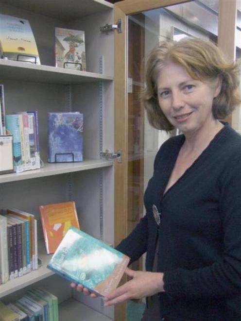 Waitaki district libraries manager Lorraine Weston-Webb admires the new display cabinets for the...