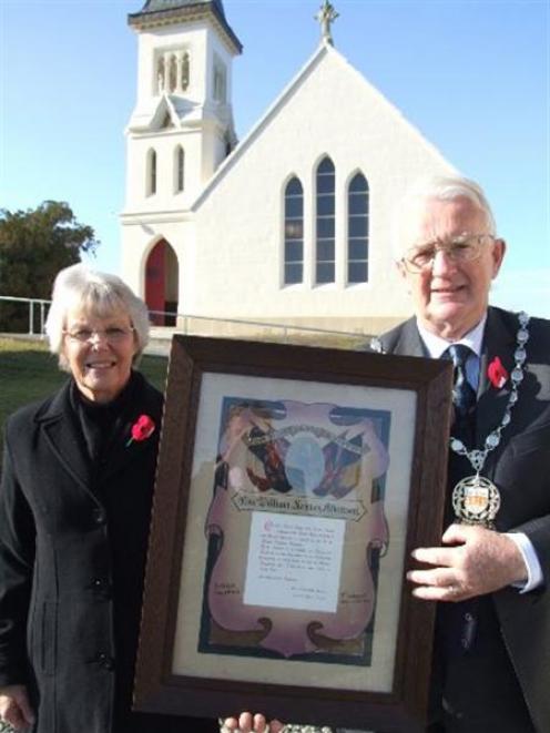 Waitaki Mayoress and Mayor Heather and Alex Familton display the certificate presented to Mr...