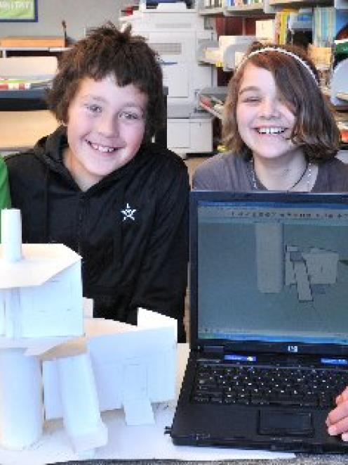 Waitati School pupils (from left) Albert Baeumer (12), Mihai Whitaker (10), Lydia Morris (11) and...