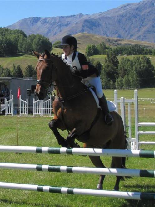 Wakatipu Pony Club member Emma Milliken marshals her horse, 45 South, over a gate in the...